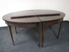 A Victorian mahogany D-end dining table with two leaves