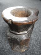 A carved hardwood tribal vessel