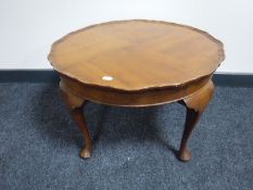 A walnut pie crust edge coffee table