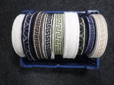 A box of nine spools of vintage Silver Cross pram trim