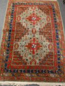 A Persian rug on red ground