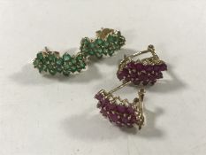 A pair of ruby cluster earrings set in gold,