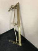 An early 20th century brass fire curb