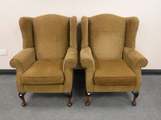 A pair of Parker Knoll wingback armchairs