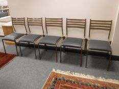 A set of nine metal framed stacking chairs