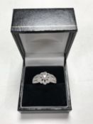 An 18ct white gold diamond encrusted ring, size U.