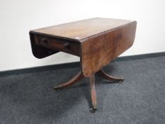 A Victorian mahogany drop leaf table fitted a drawer