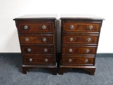 A pair of Regency style four drawer chests