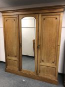 A Victorian mahogany triple door wardrobe by Sopwith & Co of Newcastle,