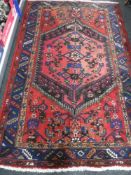 A Persian rug on red ground