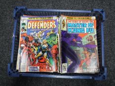 A basket containing approximately sixty 1970's and later Marvel comics