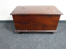 A reproduction mahogany blanket box