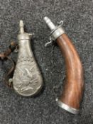 A replica flintlock pistol together with two shot flasks