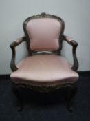 A French salon armchair upholstered in a pink fabric