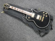 A vintage Jedson Les Paul style guitar in carry bag