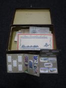 An early twentieth century case containing albums of cigarette cards