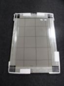 A frameless two tone sectional mirror