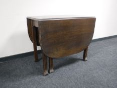 An early 20th century oak gate leg table