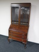 A mahogany bureau bookcase on claw and ball feet