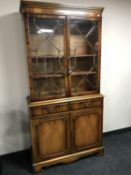 A yew wood Regency style bookcase