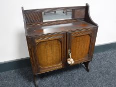An Edwardian mahogany double door wall cabinet
