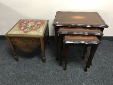 A nest of three inlaid mahogany tables and a commode