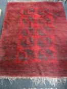 An Eastern carpet on red ground