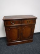An inlaid mahogany double door cabinet CONDITION REPORT: 77cm wide by 28cm deep by