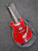 A Japanese 335 electric guitar in carry bag