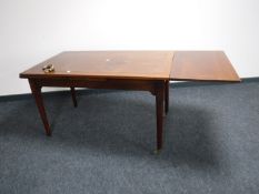 A mahogany pull out dining table
