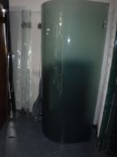 A glass shower enclosure with tray