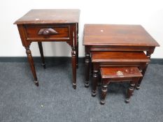 A nest of three reproduction tables and a side table fitted a drawer