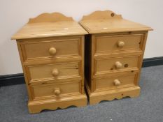 A pair of pine three drawer bedside chests