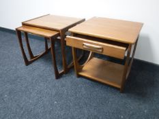 A nest of two teak G Plan tables and a side table fitted a drawer