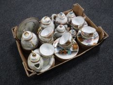 A box of two Japanese egg shell tea sets