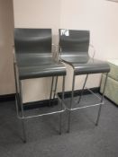 Two contemporary bar stools on metal legs