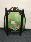 A late Victorian mahogany framed three way folding fire screen with hand painted glass panels