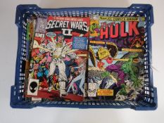 A basket containing approximately sixty 1970's and later Marvel comics