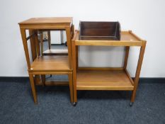 A pair of teak side tables, a pine framed mirror,