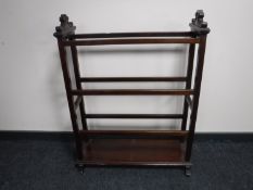 An Edwardian mahogany towel rail
