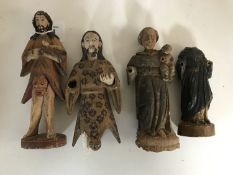 Four antique painted religious figures,