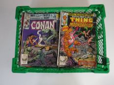 A basket containing approximately sixty 1970's and later Marvel comics
