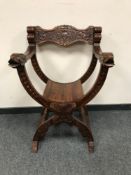 A reproduction Savonarola armchair,