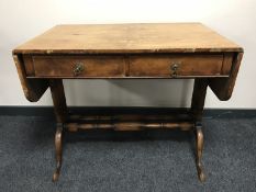 A Victorian walnut sofa table fitted two drawers