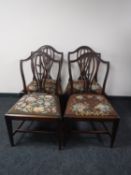 Four shield backed dining chairs CONDITION REPORT: All four chairs with a small