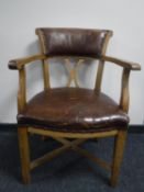An oak upholstered armchair