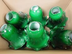 A box of thirteen green glass light shades