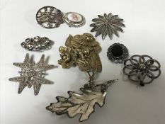 Ten silver brooches (10)