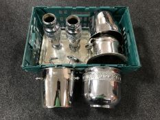 A box of plated serving trays, two embossed vases,