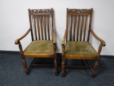A pair of oak carver armchairs CONDITION REPORT: One chair with split forming in